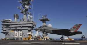 A Navy F-35C conducts its first-ever arrested landing aboard the carrier USS Nimitz