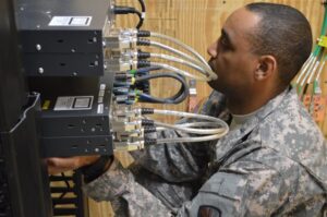 rmy , Air Force move data over same network for first time at Joint Base San Antonio Spc. Shannon January from the 56th Signal Battalion at Joint Base San Antonio-Fort Sam Houston, Texas, holds new switches in place while other technicians fasten them to a rack.http://www.army.mil/article/134148/Army__Air_Force_move_data_over_same_network_for_first_time_at_Joint_Base_San_Antonio/