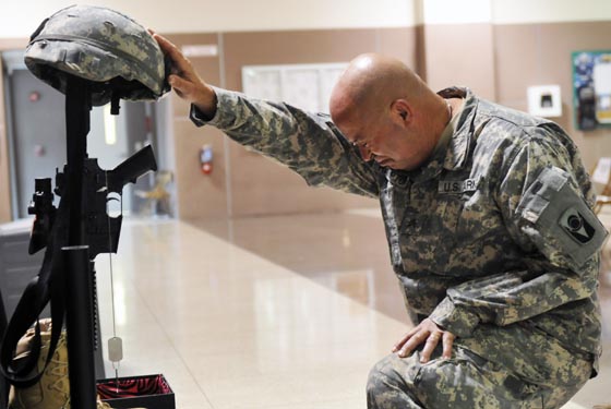 A Florida National Guard soldier mourns a fallen comrade.