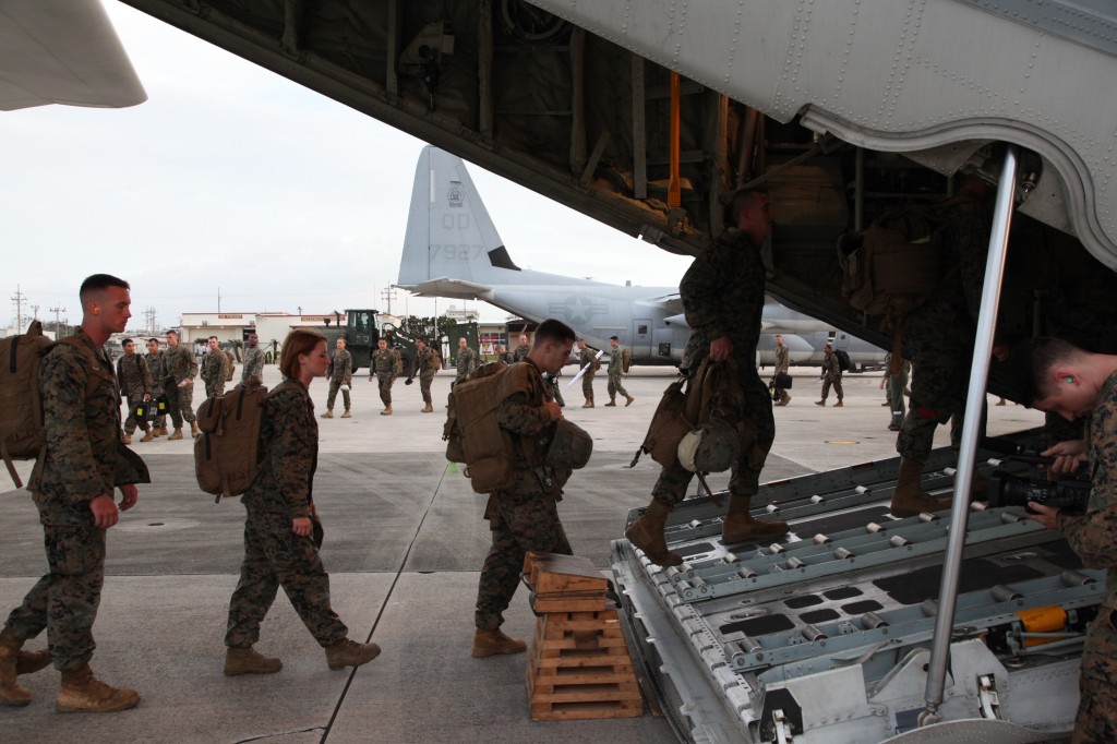 US Marines board aircraft bound for the Philippines to help with disaster relief after Typhoon Haiyan.