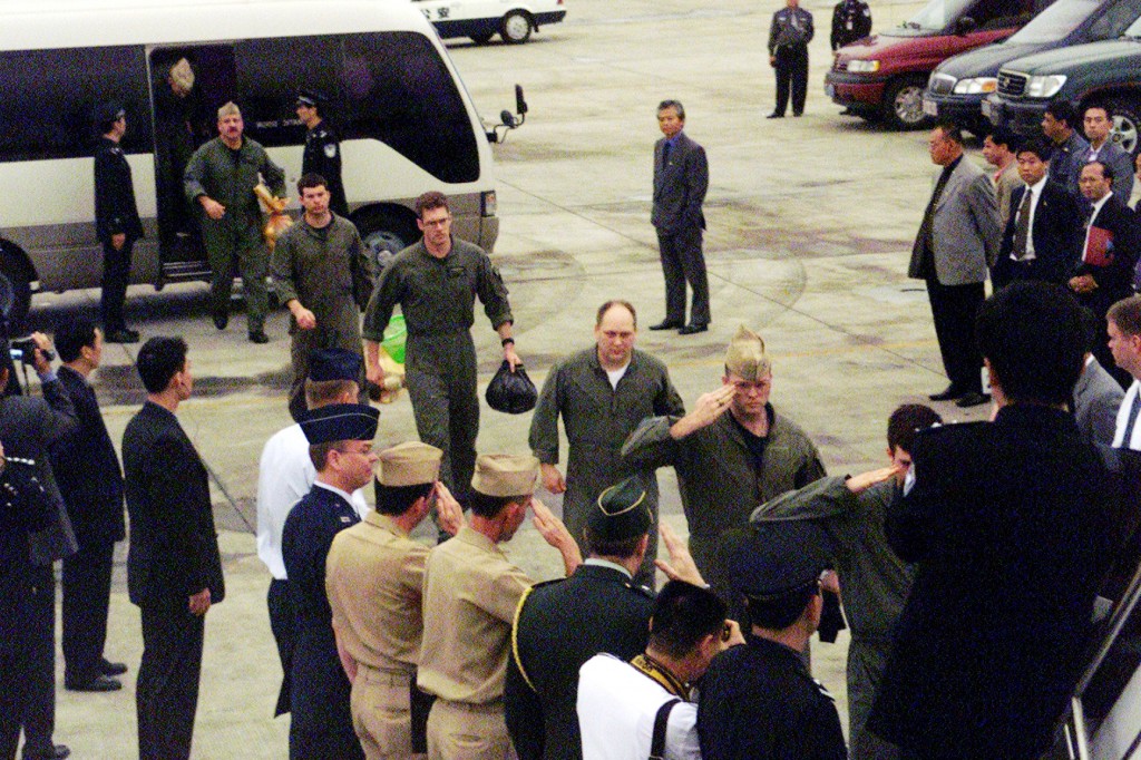 After 11 days in Chinese hands, the crew of a downed US Navy EP-3 spyplane leave Hainan Island in 2001.