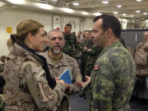 Spanish and Canadian troops aboard the USS Arlington