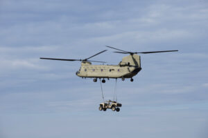 DAGOR sling-loaded under a CH-47 Chinook.