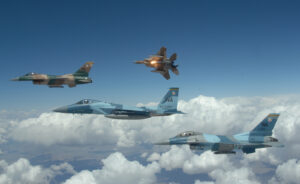 A flight of Aggressor F-15 Eagles and F-16 Fighting Falcons fly in formation over the Nevada Test and Training Ranges on 5 June, 2008. The jets are assigned to the 64th and 65th Aggressor squadrons at Nellis Air Force Base, Nev. The Aggressor mission is to prepare the combat air forces, joint and allied aircrews for tomorrowÕs victories with challenging and realistic threat replication, training, academics and feedback. (U.S. Air Force photo/ Master Sgt. Kevin J. Gruenwald) released