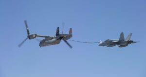 A V-22 refuels a Navy F-18 fighter.