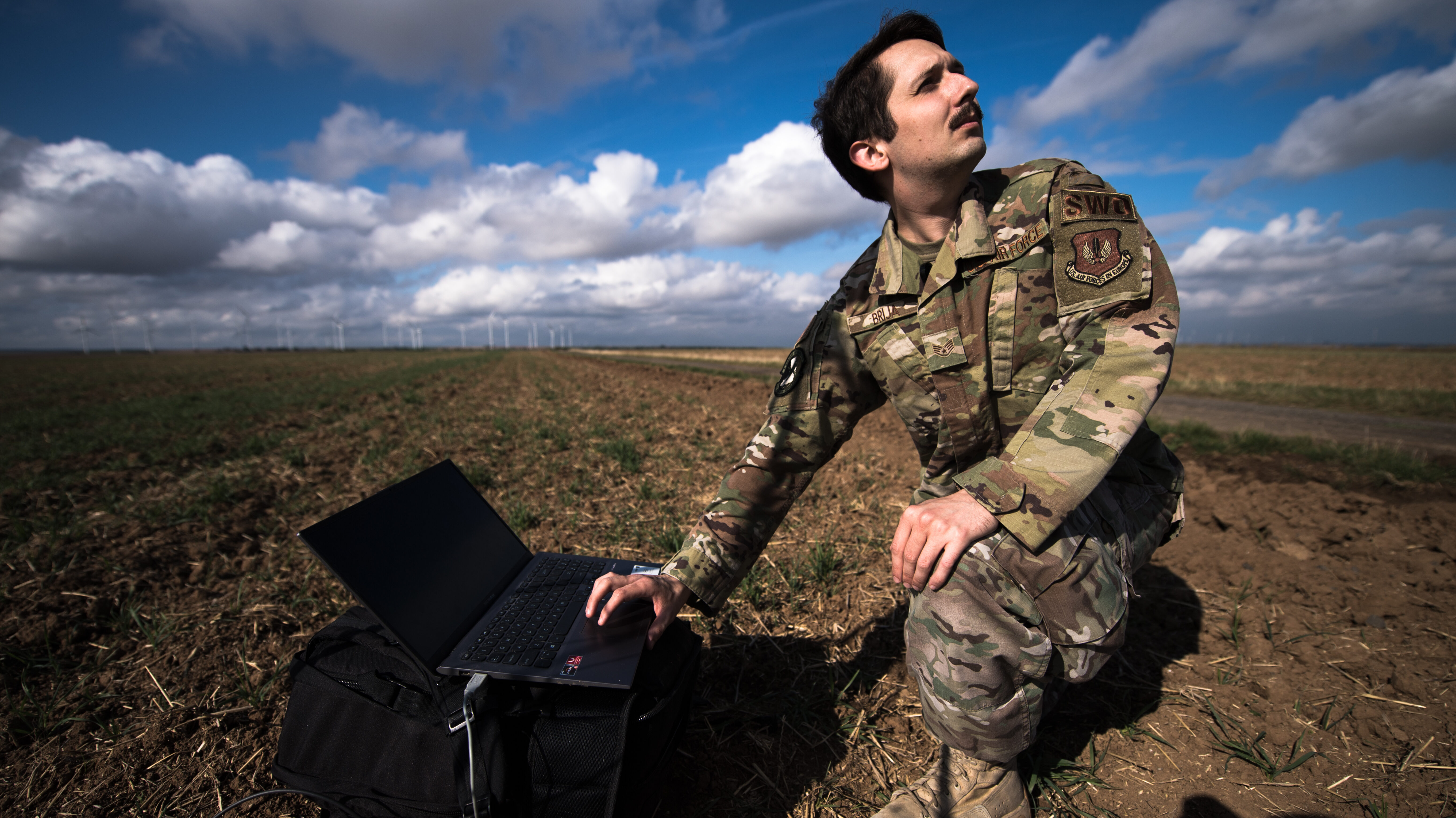 U.S. Air Force Staff Sgt. Casey Brija, 7th Weather Squadron weather forecaster, uses his instruments to measure cloud height, wind speed and wind direction at Alzey Dropzone, Flörsheim-Dalsheim, Germany, Sept. 30, 2020. Brija was responsible for collecting weather data to ensure Airmen could conduct airborne insertion operations. (U.S. Air Force photo by Staff Sgt. Devin Boyer)