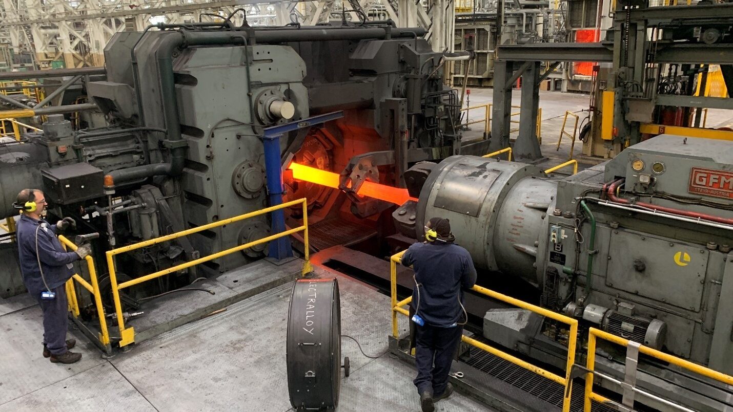 Watervliet Arsenal forge workers monitor a cannon tube being processed through the current rotary forge.