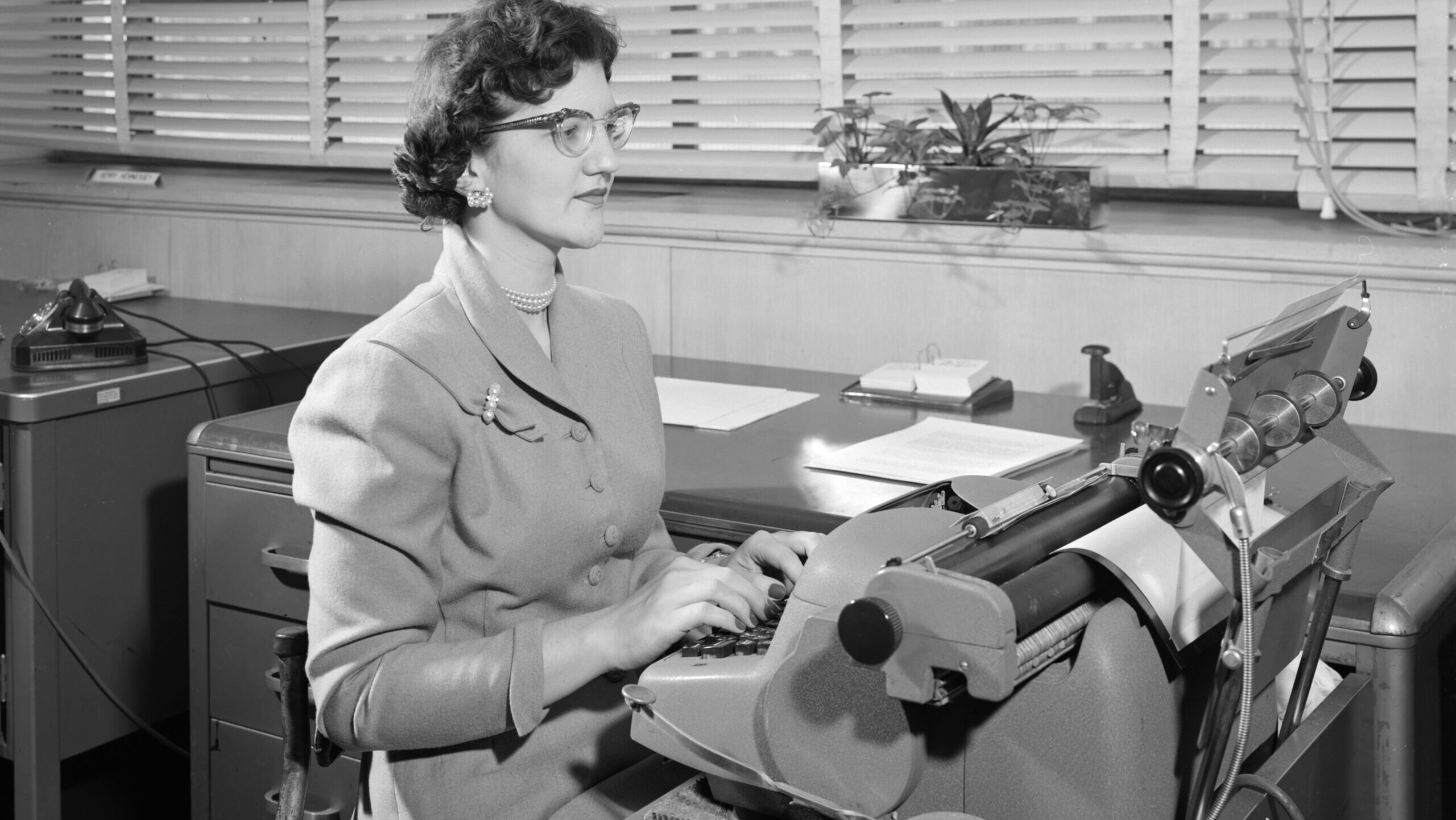 REPORT TYPIST – ROSE DLUBAC – AT ELECTRONIC TYPEWRITER