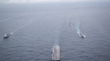 Japan Maritime Self-Defense Force Izumo-class multi-functional destroyer JS Kaga (DDH 184) (center), accompanied by JMSDF escorts, and U.S. Navy Ticonderoga-class guided missile cruiser USS Robert Smalls (CG 62) (right) forces sail together in the Philippine Sea, Oct. 20, 2025 in support of Annual Exercise (ANNUALEX) 25. ANNUALEX is a multilateral exercise that enhances the Japan and U.S. alliance, strengthens naval interoperability and demonstrates a joint commitment to a free and open Indo-Pacific. (U.S. Navy photo by Petty Officer 1st Class R. Ezekiel Duran)