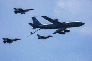 A file photo shows an U.S. Air Force KC-135R Stratotanker with the New Jersey Air National Guard’s 108th Wing and F-16 Fighting Falcons with the 177th Fighter Wing simulate a mid-air refueling. (New Jersey National Guard photo by Mark C. Olsen)