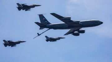 A U.S. Air Force KC-135R Stratotanker with the New Jersey Air National Guard’s 108th Wing and F-16 Fighting Falcons with the 177th Fighter Wing simulate a mid-air refueling. (New Jersey National Guard photo by Mark C. Olsen)