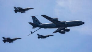 A file photo shows an U.S. Air Force KC-135R Stratotanker with the New Jersey Air National Guard’s 108th Wing and F-16 Fighting Falcons with the 177th Fighter Wing simulate a mid-air refueling. (New Jersey National Guard photo by Mark C. Olsen)