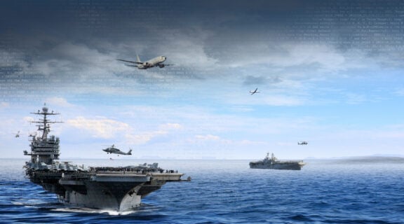 The Network Tactical Common Data Link system allows carrier strike groups to communicate across air and naval assets to streamline information sharing and command and control. (US Navy photo)