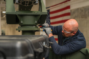 An L3Harris employee works on the company's new high-volume production line for VAMPIRE™ counter-unmanned systems in Huntsville, Alabama.