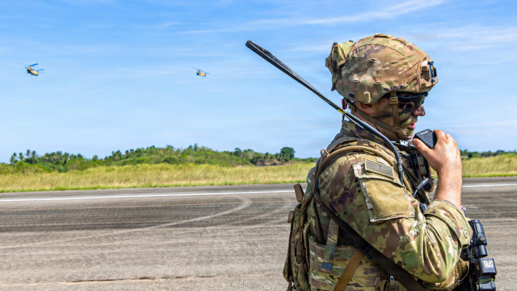U.S. Army Sgt. 1st Class Joseph York, assigned to 3rd Mobile Brigade, 25th Infantry Division, communicates via radio during Operational Maneuver, the culminating event of Salaknib 2026 at Lal-Lo Airport, Philippines, June 13, 2026. (U.S. Army photo by Pfc. Jose Nunez)