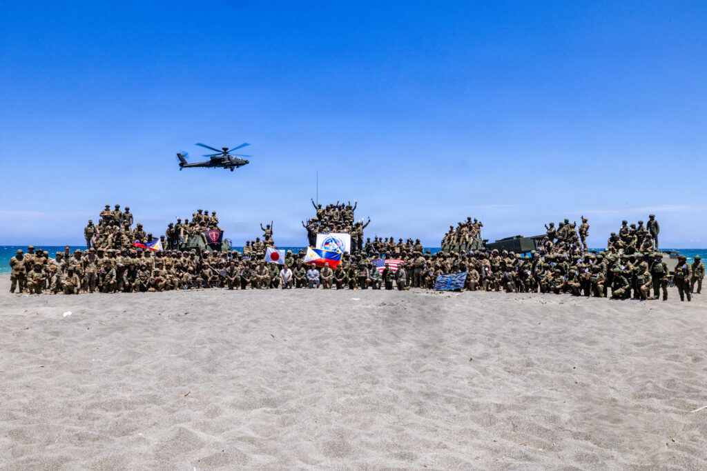 Multinational partners pose for a photo after a counter-landing live-fire exercise as part of Exercise Balikatan 2026 at La Paz Sand Dunes, Laoag City, Philippines, May 4, 2026. Balikatan is a longstanding annual exercise between the Armed Forces of the Philippines and U.S. military. (U.S. Army photo by Sgt. Duke Edwards)