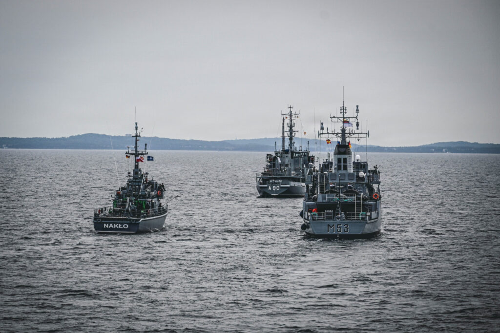 Latvian Navy Buyskes-class survey vessel LVNS Varonis (A 90), Polish Navy's Gardno-class minesweeper, ORP Nakło (640), and Lithuanian Naval Force Hunt-class mine countermeasures vessel LNS Skalvis (M 53) steam across the Baltic Sea as part of Baltic Operations