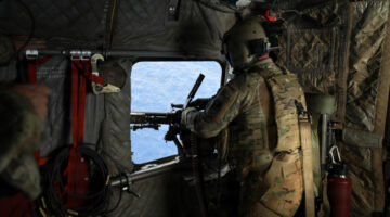 U.S. Army Soldiers assigned to 25th Combat Aviation Brigade, 25th Infantry Division, conduct an experimental over water gunnery exercise in a CH-47 Chinook over the Pacific Ocean, Sept. 29, 2026. U.S. Army's expanded rapid-fielding and modernization initiative is designed to test and integrate emerging technologies directly with soldiers in active formations. (U.S. Army photo by Capt. Katie Kolb)