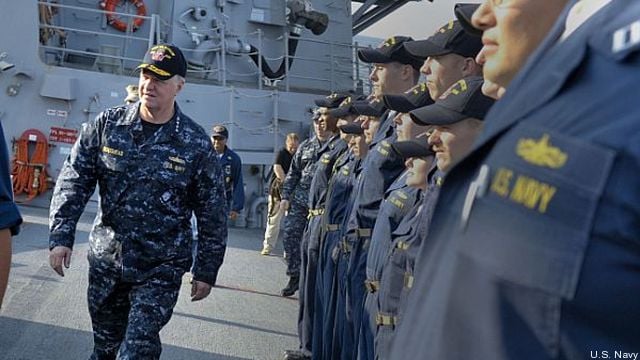 Sailors aboard the destroyer USS Sampson