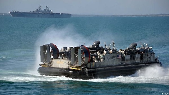 Navy LCAC hovercraft like this one carry Marine vehicles, supplies, and heavy equipment ashore.