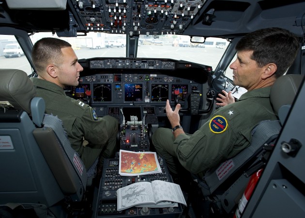 Rear Adm. Bill Moran (right) in the cockpit of the Navy's new P-8A Poseidon reconnaissance plane.