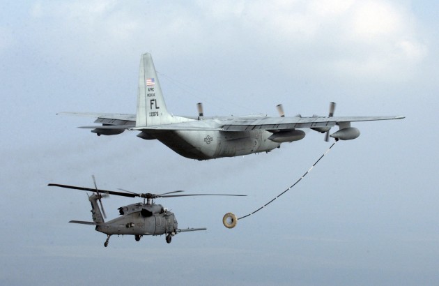 An Air Force Special Operations tanker refuels a helicopter searching for survivors of 2005's Hurricane Rita.
