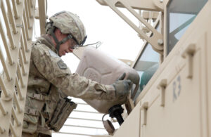 A soldier refuels his mine resistant ambush protected vehicle during a convoy break in Afghanistan. DLA Energy provides the Army with petroleum, coal, natural gas and helium, among other energy products. Photo by Army Sgt. Kimberly Trumbull