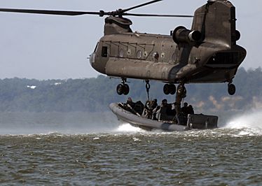 JSOC troops Chinook and boat