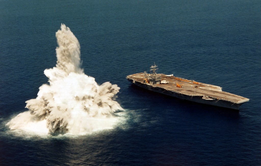 A US Navy carrier, the USS Roosevelt, undergoing "full-ship shock trials" using live explosives.
