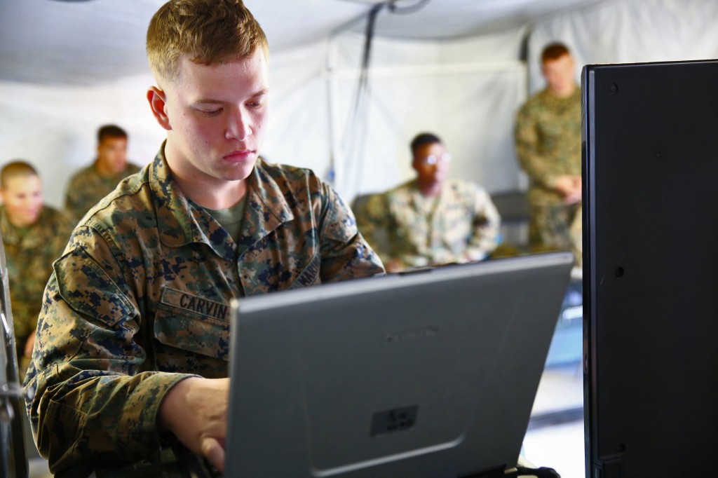 Lance Cpl. Shawn E. Carvin, wireman, Communications Company, Combat Logistics Regiment 15, 1st Marine Logistics Group, practices programing during a class on radio programing aboard Camp Pendleton, Calif., Feb. 12, 2014. The class was part of a two-week line training exercise, a series of hands-on instruction on communications systems in preparation for the unit’s upcoming Combat Operations Center exercise. (Photo by Cpl. Timothy Childers)http://www.1stmlg.marines.mil/News/NewsArticleDisplay/tabid/8628/Article/158988/1st-mlg-conducts-communications-training.aspx