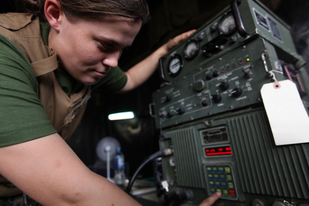 Lance Cpl. Erica Rindal a digital multi channel wide band transmission equipment operator, Marine Wing Communications Squadron 18, Marine Aircraft Group 36, 1st Marine Air Wing, III Marine Expeditionary Force, checks the frequencies after sweeping the air for a better signal on the tactical elevated antenna mast system at Korat Royal Thai Air Force Base Feb. 12 during Exercise Cobra Gold 2011. Cobra Gold 2011 is a regularly scheduled multinational joint training exercise designed to improve international relationships within the south Pacific region. (U.S. Marine Corps photo by Cpl. J Nava/Released)::r::::n:: (Photo by Cpl. J Nava)http://www.iiimef.marines.mil/News/NewsArticleDisplay/tabid/967/Article/14039/marine-wing-communications-squadron-18-keeps-marine-aircraft-group-36-connected.aspx