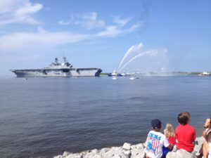 LHA-6 USS America sails - kids in foreground