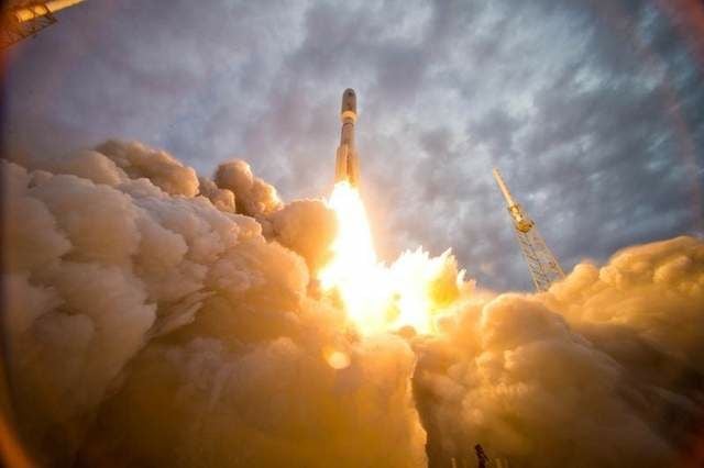Russian-made RD-180 engines propel an Atlas V rocket heavenward.