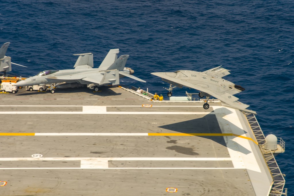 140817-N-CE233ATLANTIC OCEAN (August 17, 2014) – The Navy’s unmanned X-47B conducts flight operations aboard the aircraft carrier USS Theodore Roosevelt (CVN 71). The aircraft completed a series of tests demonstrating its ability to operate safely an