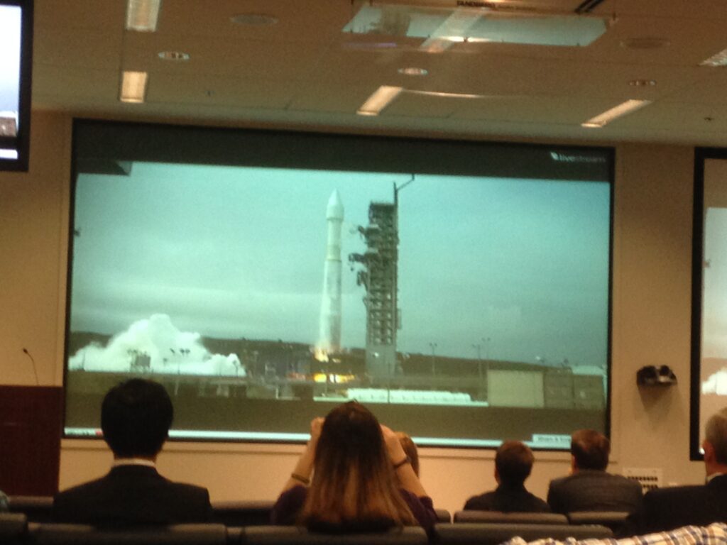Lockheed Martin employees and guests watch their Atlas V rocket launch the WorldView-3 satellite on Wednesday.