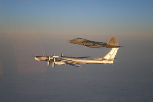 A Russian Tu-95 Bear bomber being escorted away from US airspace by an F-22 in a 2007 incident.