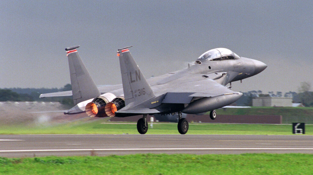 981001-F-0024F-004 With its afterburners glowing, a U.S. Air Force F-15E Eagle lifts off from the runway at R.A.F. Mildenhall, England, on Oct. 1, 1998.  The Eagle is deploying to a forward location as part of the four air expeditionary wings the U.S. Air Force has formed in support of possible NATO contingency operations in Kosovo.  The F-15 Eagle is an all-weather, extremely maneuverable, tactical fighter designed to gain and maintain air superiority in aerial combat. The aircraft belongs to the 494th Fighter Squadron, R.A.F. Lakenheath, England.  DoD photo by Tech. Sgt. Brad Fallin, U.S. Air Force.  (Released)