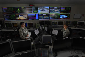 Staff Sgt. Alex Garviria, 721st Communication Squadron senior systems controller, and 2nd Lt. Rachel James, 721st CS crew commander, work in the Global Strategic Warning and Space Surveillance System Center at Cheyenne Mountain Air Force Station, Colo., Sept. 2, 2014. The 721st CS provides continuous monitoring of the strategic missile warning systems to ensure a constant dataflow of key information to North American Aerospace Defense Command (NORAD), U.S. Northern Command, U.S. Strategic Command, Air Force Space Command, Secretary of Defense, President of the United States, strategic, and theater commanders. (U.S. Air Force photo by Airman 1st Class Krystal Ardrey)