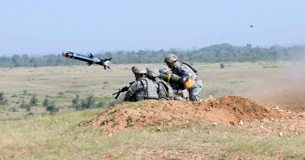 Army soldiers fire a Javelin anti-tank missile.