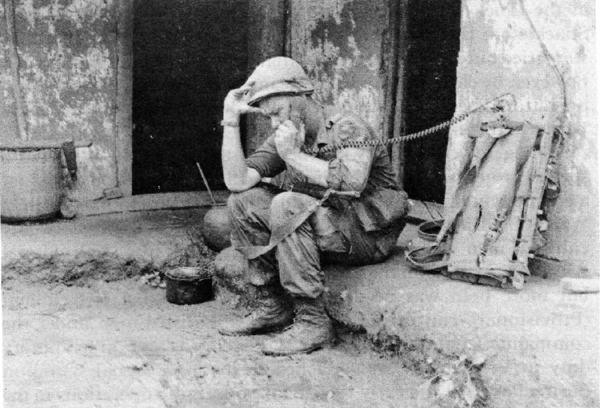A soldier using a radio in Vietnam.