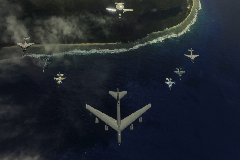 A U.S. Air Force B-52 Stratofortress from the 20th Expeditionary Bomb Squadron at Barksdale Air Force Base, La., leads a formation of two F-16 Fighting Falcons from the 18th Aggressor Squadron, Eielson AFB, Alaska; two Japan Air Self-Defense Force F-2 fighters from the 6th Tactical Fighter Squadron, Tsuiki Air Base, Japan; two U.S. Navy EA-6B Prowlers from Electronic Attack Squadron 136, Carrier Air Wing 5, Naval Air Facility Atsugi, Japan; and a JASDF E-2C Hawkeye from the 601st Squadron, Misawa Air Base, Japan, over Guam during exercise Cope North. The Air Force and JASDF conduct Cope North annually at Andersen Air Force Base, Guam, to increase combat readiness and interoperability. (U.S. Air Force photo/Staff Sgt. Jacob N. Bailey)