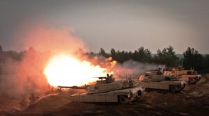 M1 Abrams tanks of the 1st Cavalry Division fire during a NATO Atlantic Resolve exercise in Latvia.
