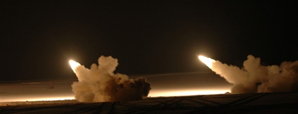 Multiple Launch Rocket System MLRS fires at night