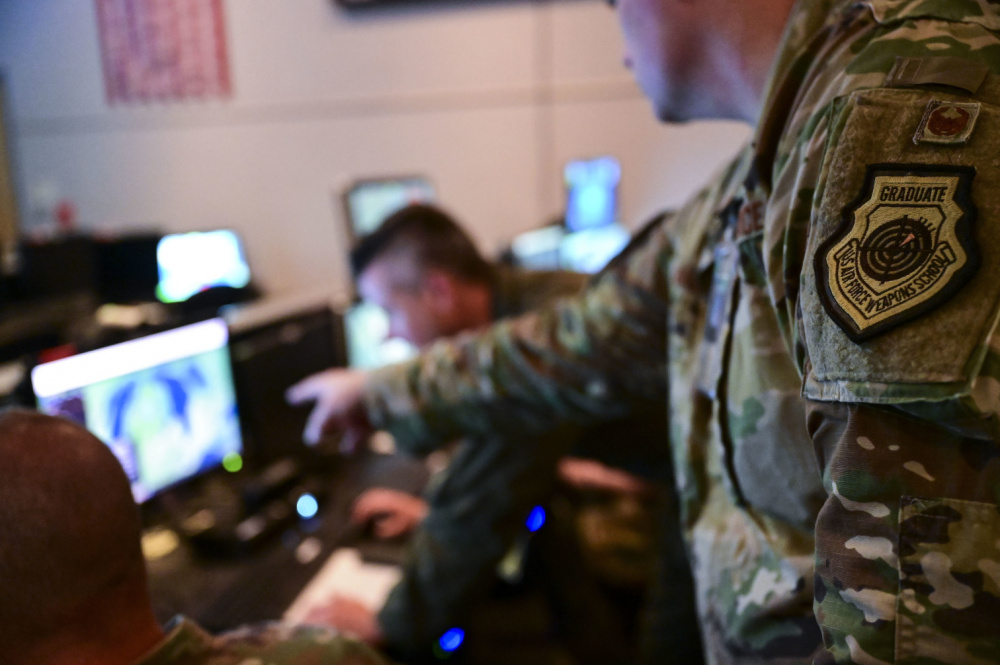 Airmen from the New York, Washington and Maryland Air National Guard monitor aircraft during the Global Information Dominance Experiment 3 in conjunction with the Architecture Demonstration and Evaluation 5 event at the 601st Air Operation Center on Tyndall Air Force Base, Fla., July 14, 2021.