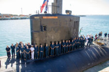 AUKUS Announcement The crew of USS Asheville assemble on the casing of the submarine during their visit to HMAS Stirling in Rockingham, Western Australia. *** Local Caption *** On 14 March 2023, the Government announced the first initiative under an enhanced trilateral security partnership with the United Kingdom and the United States (AUKUS) that will identify the optimal pathway for the acquisition of at least eight nuclear-powered submarines for the Royal Australian Navy.