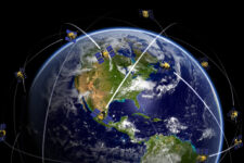 Satellites over world globe monitoring GPS localization