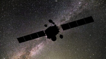 Communications satellite on the background of the starry sky. Satellite connection