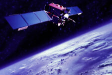 Communications satellite orbiting above Earth