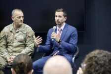 Gen. Ed Barker and Mark Kitz speak on a panel together.