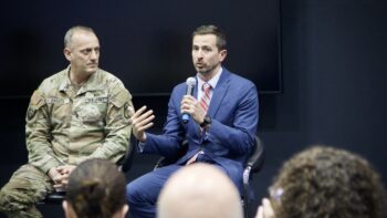 Gen. Ed Barker and Mark Kitz speak on a panel together.